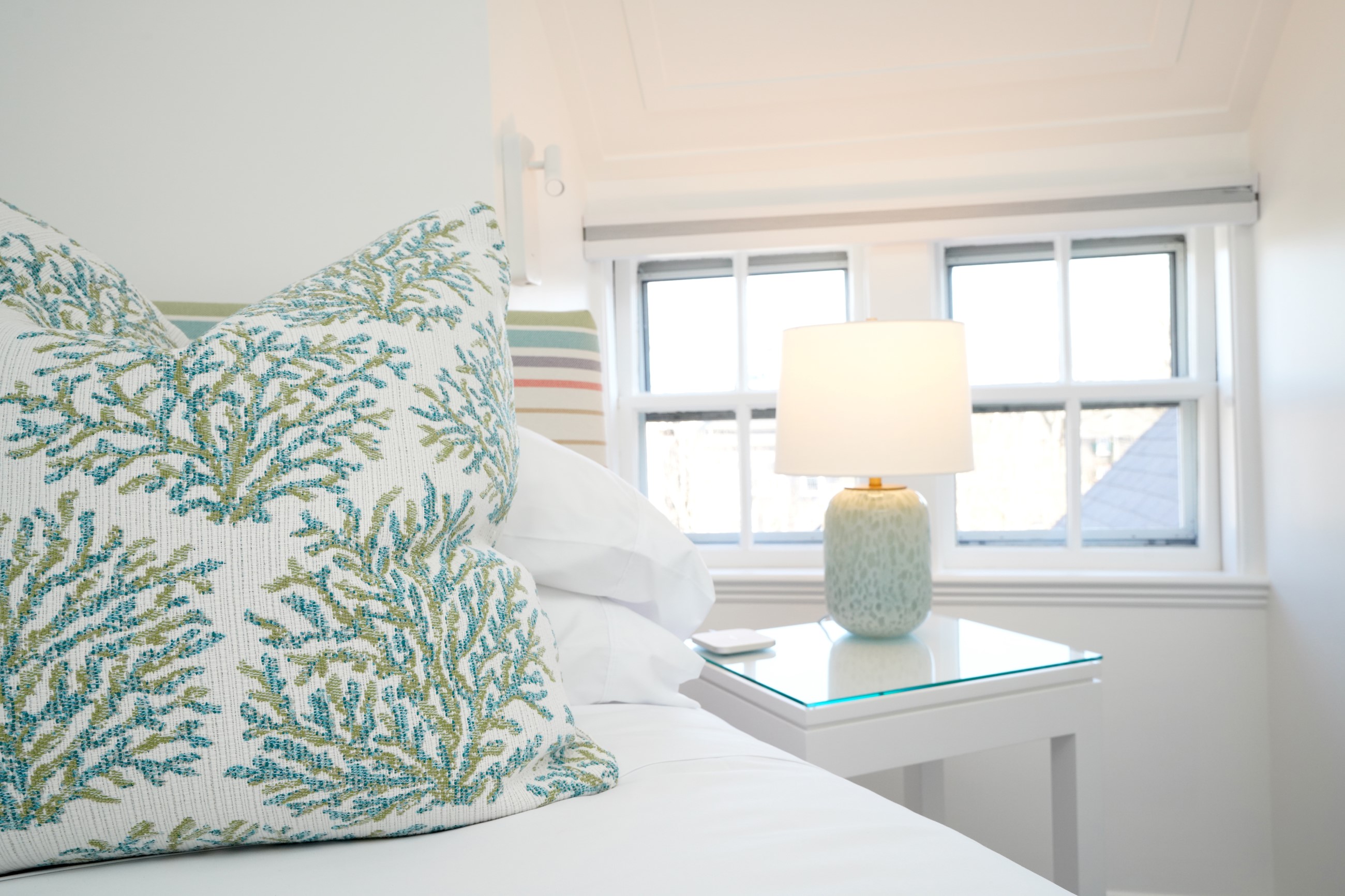 Close up of a bed side table in the standard queen room